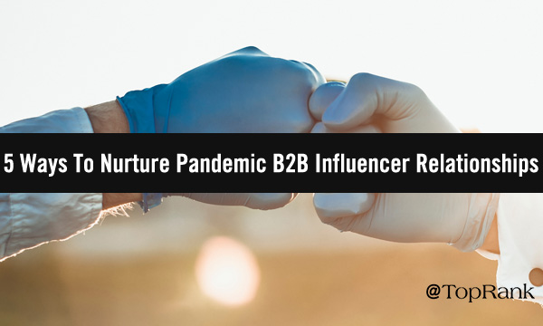 Two glove-covered hands fist-bumping image.